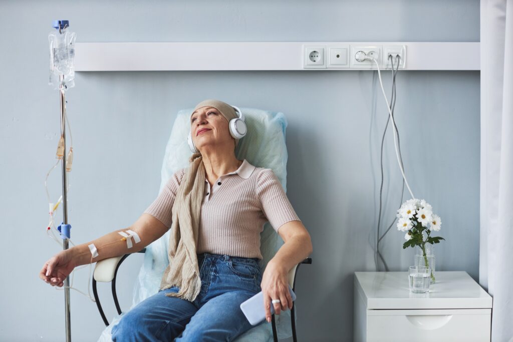 Portrait,Of,Senior,Woman,Sitting,In,Comfortable,Chair,With,Iv