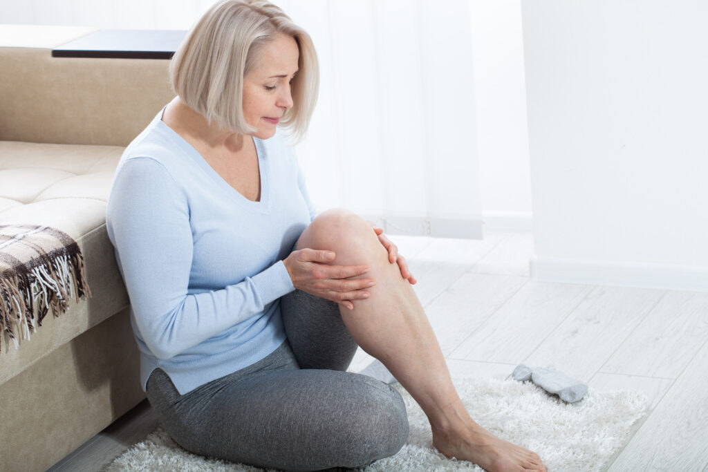 Middle-aged,Woman,Suffering,From,Pain,In,Leg,At,Home,,Closeup.